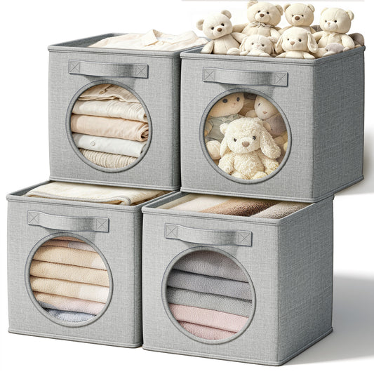 Four light grey linen storage cubes with round windows and handles