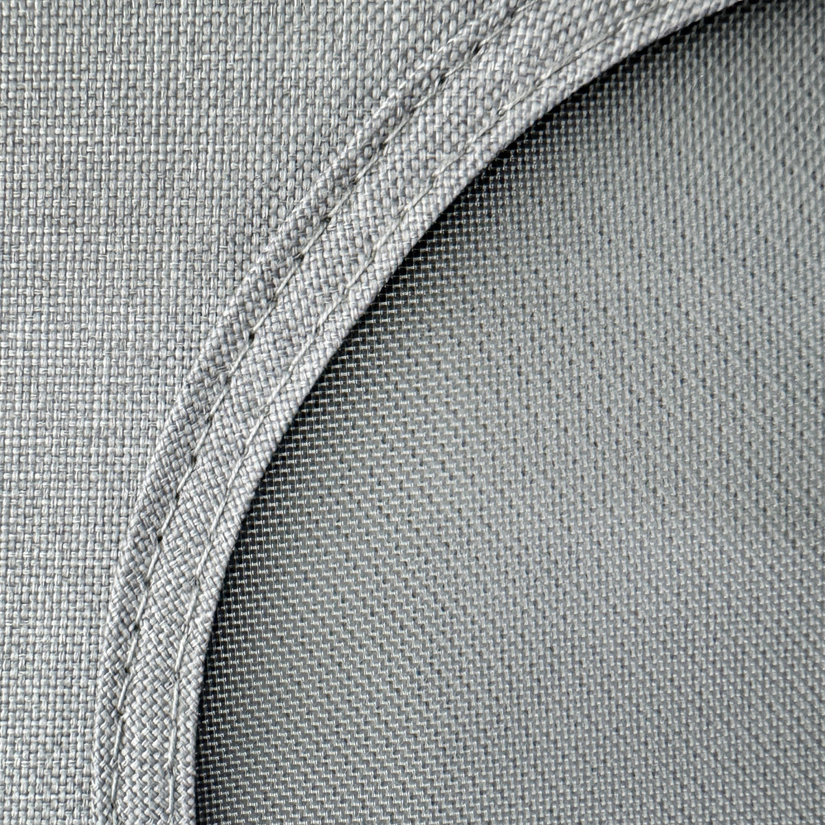 Close-up of the linen weave and round window of the storage cube