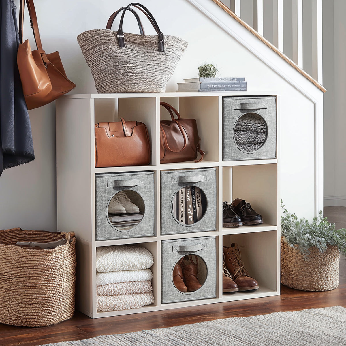 Storage cubes in an entryway cube shelf holding shoes, bags and folded towels